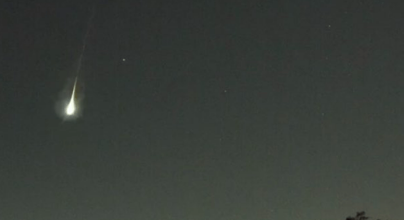 Meteor streaking across the night sky.