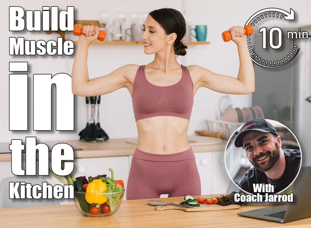 Portrait of happy sporty woman blogger showing biceps with dumbbells and leading video conference on healthy eating on laptop in kitchen. 6 Kitchen Counter Moves That Build More Muscle Than CrossFit After 50. Cover