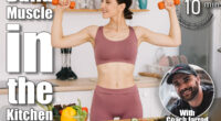Portrait of happy sporty woman blogger showing biceps with dumbbells and leading video conference on healthy eating on laptop in kitchen. 6 Kitchen Counter Moves That Build More Muscle Than CrossFit After 50. Cover