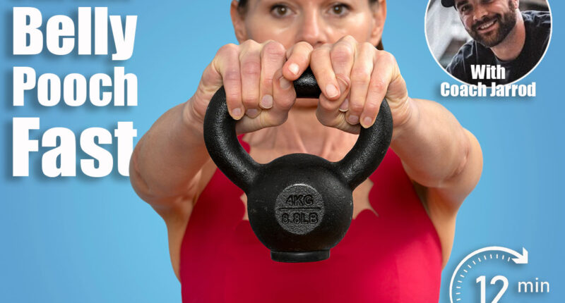 close up of a woman athlete in red sportswear lifting a kettlebell weight against blue background. 6 Standing Exercises That Shrink Belly Pooch Better Than Crunches After 40. Cover