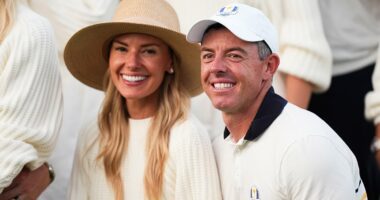 Erica's last laugh: Rory McIlroy's wife grabs a champagne glass to...