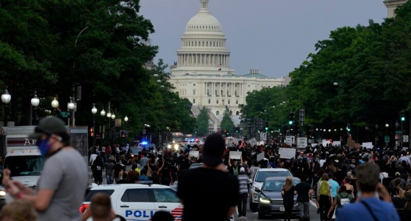 FBI fires agents photographed kneeling during 2020 racial justice protest, AP sources say