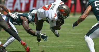 Fake tush push and special teams TD help Eagles beat Bucs 31-25 to stay undefeated