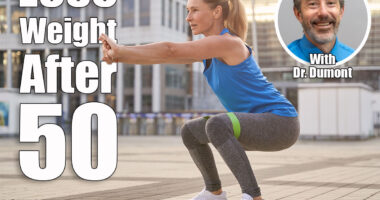 Attractive middle aged woman in sportswear doing squats using resistance band, having workout in the city. Is Cutting Calories Enough to Lose Weight After 50? Cober
