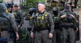 Masked federal agents patrol downtown Chicago
