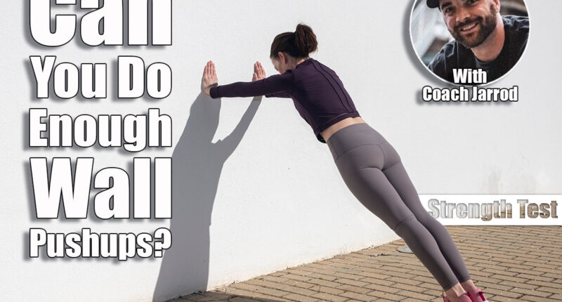 Sporty woman doing press ups against a white wall outside. Over 40? If You Can Do This Many Wall Pushups, Your Strength Is Above Average. Cover