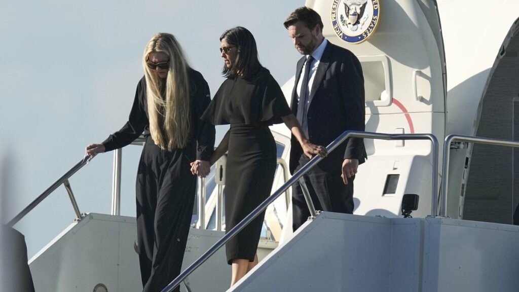 Powerful moment Charlie Kirk's widow Erika holds hands with Usha Vance