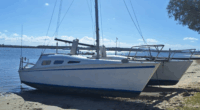 A search is underway for two men after their boat disappeared off the NSW coast on its way to Queensland.