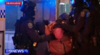 9News has obtained exclusive vision from the city venue, where the accused allegedly smashed a door, hurled a brick at a police car and refused to get down from a roof.