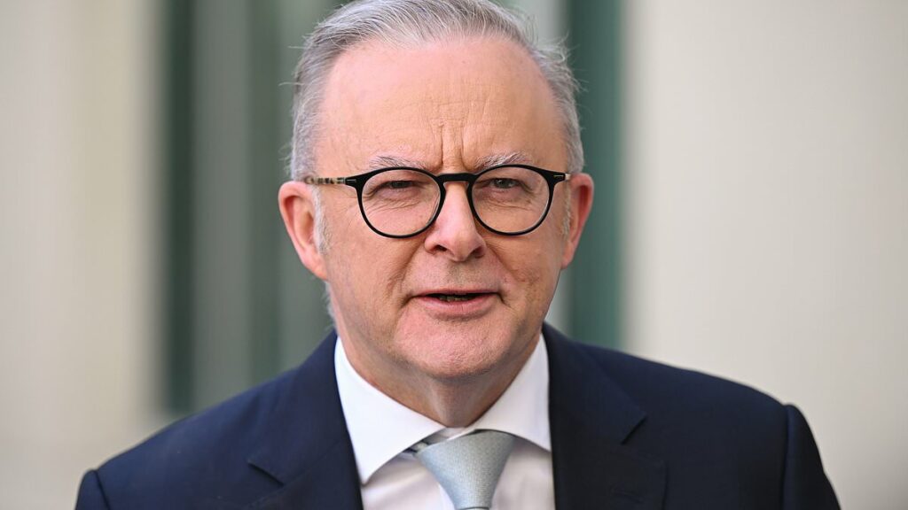 Albanese forced to leave press conference to change his shirt