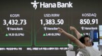 Asian shares mostly climb after US stocks remained near record levels following the Fed's rate cut