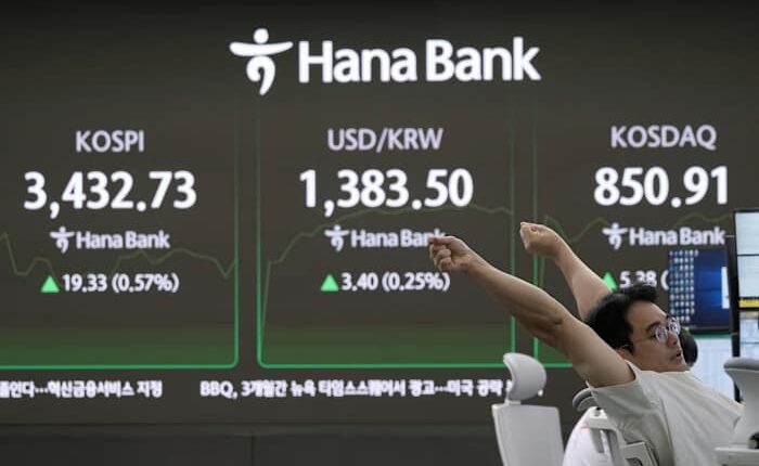 Asian shares mostly climb after US stocks remained near record levels following the Fed's rate cut