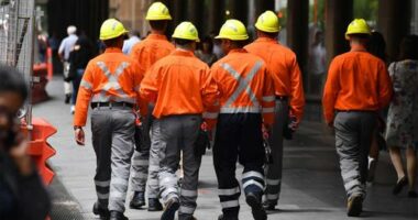 Tradies walking.