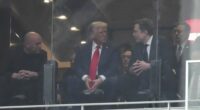 President Donald Trump and Elon Musk talk at the memorial for Charlie Kirk