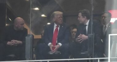 President Donald Trump and Elon Musk talk at the memorial for Charlie Kirk