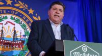 JB Pritzker speaks at a podium