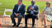Illinois Gov. JB Pritzker, left, and Chicago mMyor Brandon Johnson listen during a baseball news conference, Friday, Aug. 1, 2025, in Chicago, announcing that the Chicago Cubs' Wrigley Field will host the 2027 All-Star Game. (AP Photo/Andrew Seligman)