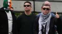 Liam Óg Ó hAnnaidh, aka Mo Chara, right, a member of the Irish language band Kneecap, celebrates as he leaves Woolwich Crown Court in London, Friday, Sept. 26, 2025, after Chief Magistrate, Senior District Judge Paul Goldspring, dismissed a terrorism offence relating to displaying a flag in support of Hezbollah during a performance with the band in November 2024, on a technical error.