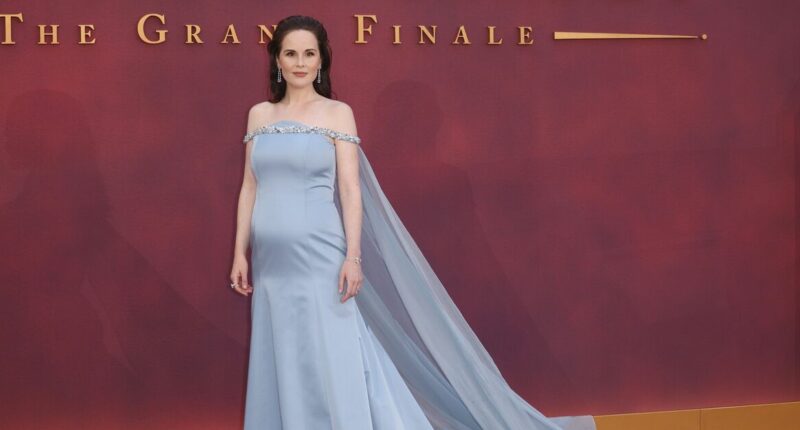 Downton Abbey star Michelle Dockery debuts pregnancy bump at premiere