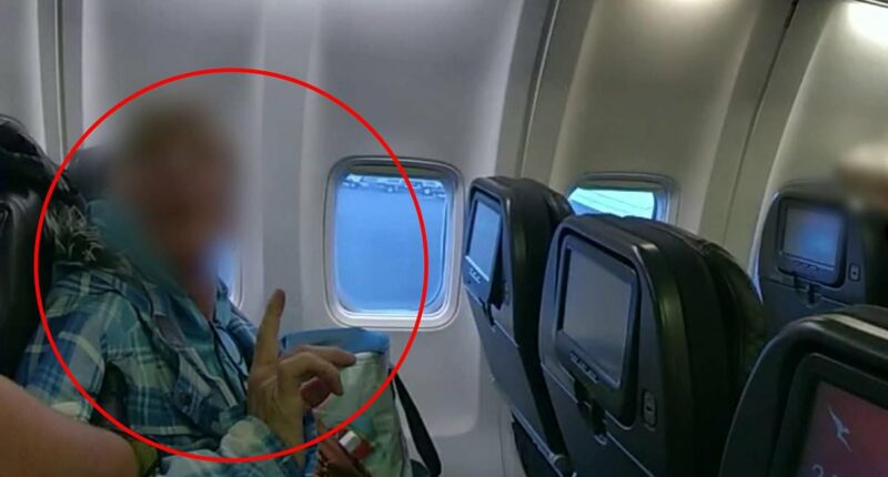 Dramatic moment cops board a Qantas flight and arrest a passenger - after alleged act forces plane to turn back before it even took off