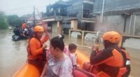 Officials say the flood waters have claimed at least two lives including a pregnant woman who was swept away.