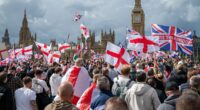 Elgar on a ghetto blaster. A sea of flags and tributes to Charlie Kirk. VERY rude chants about Keir. Then the bottles and fists began to fly... IAN GALLAGHER attends the 110,000-strong 'Unite the Kingdom' march in London