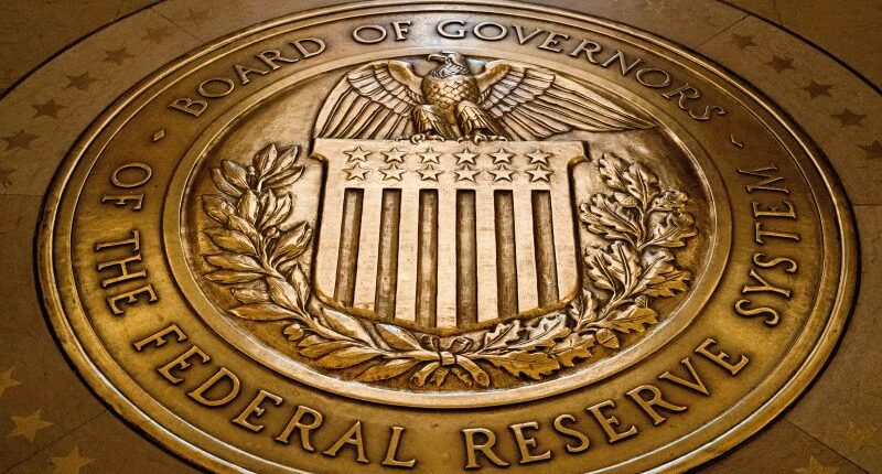 Federal Reserve cuts key rate, signals two more cuts this year
