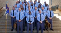 Georgia Gov. Brian Kemp swears in his daughter as a state trooper