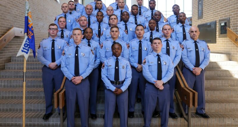 Georgia Gov. Brian Kemp swears in his daughter as a state trooper