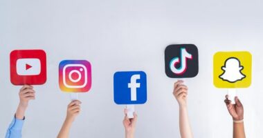 Teenagers hands hold social media signs in their hands: Youtube, Snapchat, Instagram, Tiktok, Facebook. Teenagers addicted to new technology trends - concept of youth, technology, social and friendship. Turkey, Istanbul, May 29, 2022.