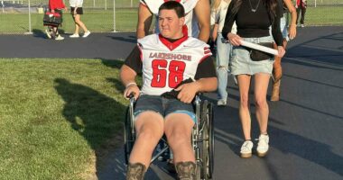 High school football player whose spine was fractured by rival in horrific attack returns to field in a wheelchair
