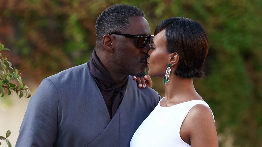 Idris Elba and wife Sabrina share a passionate kiss while his co-star Rebecca Ferguson and her husband Rory Dote pack on the PDA at A House Of Dynamite premiere during Venice Film Festival