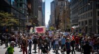 Marchers gather in worldwide protest of financial institutions 'profiting off the climate crisis'