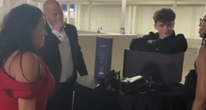 Owen Cooper joins his parents in the smoking area after scooping Emmy