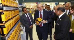 Prime Minister Anthony Albanese, with  Lulu Global Director, Global Operations & Chief Sustainability Officer Mohamed Althaf MM (left) and Lulu Chairman M. A. Yusuff Ali (right) during a visit to Lulu Hypermarket, which imports Australian goods to the UAE,  at Mushrif Mall in Abu Dhabi, United Arab Emirates on September 29, 2025.