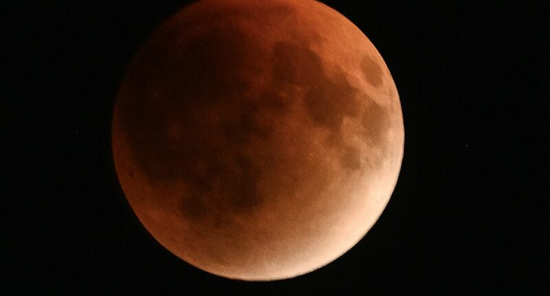 Rare Blood Moon total lunar eclipse is visible for millions of Britons NOW - here's how to see the stunning event