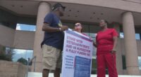 Registered nurses rally outside of Congressman Rick Allen's office