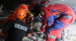 Rescuers run oxygen to survivors in Indonesia school building collapse that buried dozens