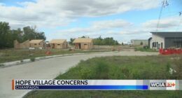 Residents outside of Hope Village asking for changes in the project