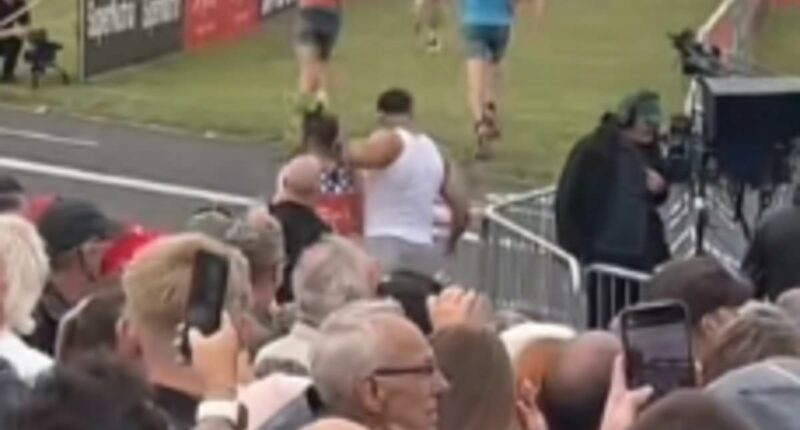 Rogue runner strikes again! Tommy Fury is caught PUSHING Great North Run rival away to get his perfect viral finish line video, days after 'LYING' about completing 100km triathlon