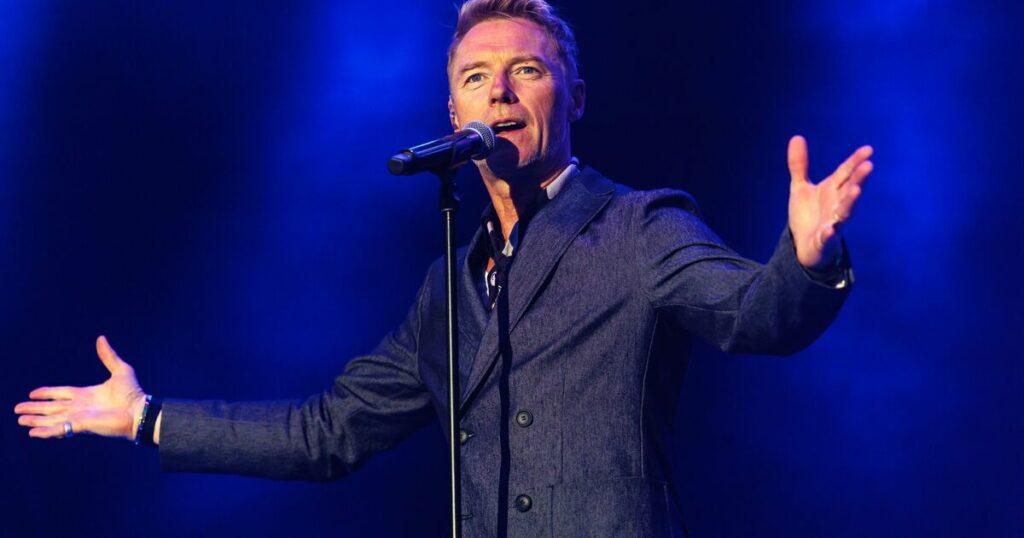 Rylan Clark backed by Ronan Keating as he dedicates song to him live on stage