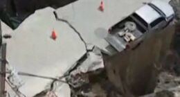 Sinkhole swallows vehicle and electrical poles