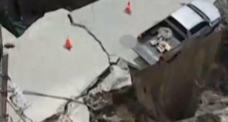 Sinkhole swallows vehicle and electrical poles