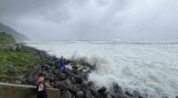 Super typhoon blowing by northern Philippines and Taiwan forces evacuations and closures