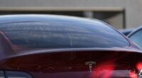 FILE - A Tesla model Y and other Telsla vehicles sit at a dealership, Wednesday, March 19, 2025, in Kennesaw, Ga. (AP Photo/Mike Stewart, File)