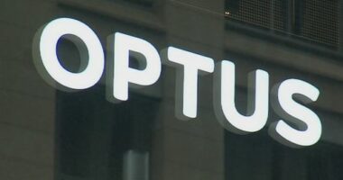 A close-up shot of an Optus store sign