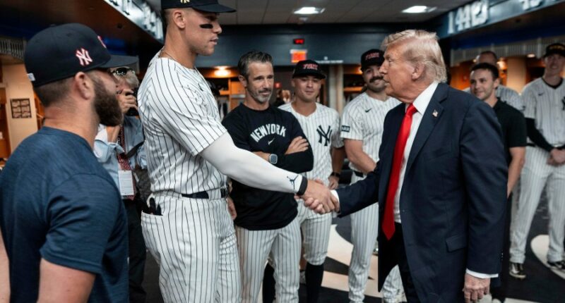 Trump draws cheers and boos while marking 9/11 by attending a New York Yankees game