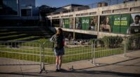 A person looks over the Utah Valley University courtyard