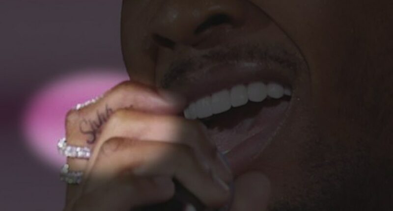 A closeup of D4vd's "Shhh..." tattoo