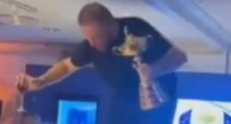 Waking up with a hangover... and a £230,000 bar bill! Europe's Ryder Cup hero Shane Lowry dances on a table as details of their wild after-party emerge